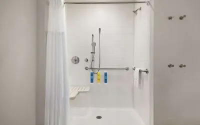 Guest bathroom with shower at Tru By Hilton Milwaukee Brookfield.