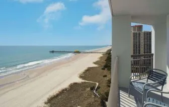 Balcony from day use room overlooking the ocean at Embassy Suites By Hilton Myrtle Beach Oceanfront Resort.