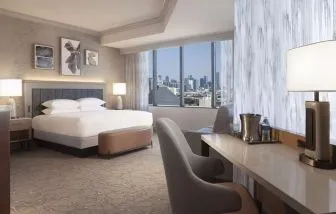 Day use room with work desk and sofa at Hilton Anatole.