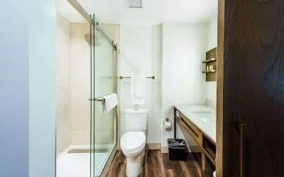 Guest bathroom with shower at Hilton Garden Inn Denver Union Station.