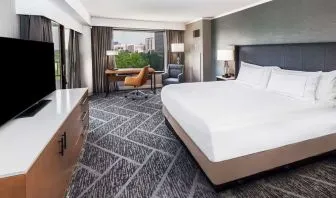 Day use room with work desk and natural light at DoubleTree By Hilton Tulsa - Warren Place.