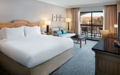 Day use room with work desk, sofa and balcony at DoubleTree By Hilton Sonoma Wine Country.