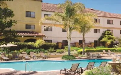 Refreshing outdoor pool surrounded by sun loungers at DoubleTree By Hilton Sonoma Wine Country.