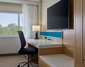 Work desk and TV at Delta Hotels By Marriott Little Rock West.