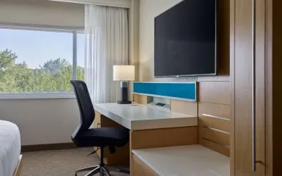 Work desk and TV at Delta Hotels By Marriott Little Rock West.