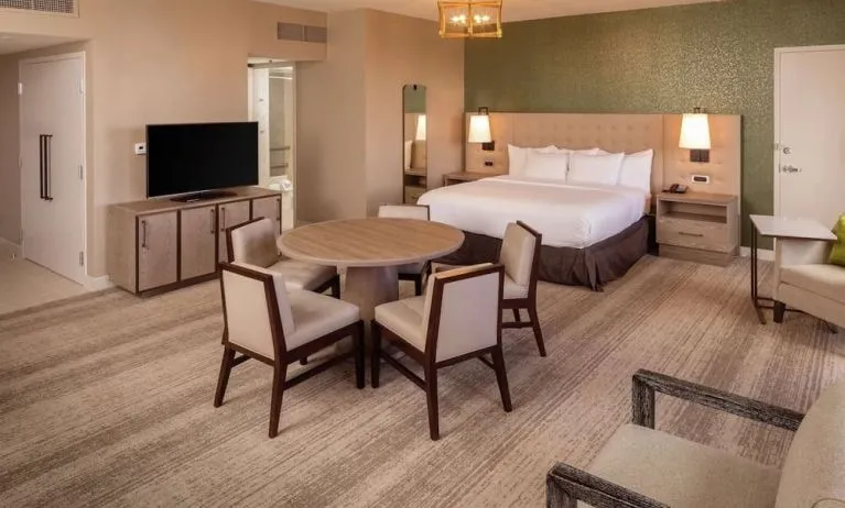 King suite with dining table at Hilton Birmingham At UAB.