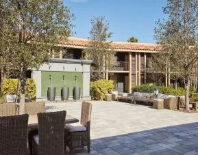 Garden with outdoor furniture at DoubleTree By Hilton Orlando At SeaWorld.