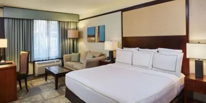 Day use room with sofa and work desk at DoubleTree By Hilton Orlando At SeaWorld.