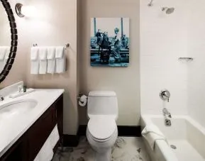 Private guest bathroom with tub at Hilton Brooklyn New York.