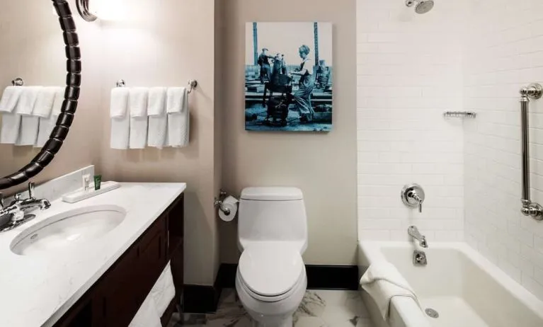 Private guest bathroom with tub at Hilton Brooklyn New York.