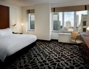 Bright and spacious day use room with work desk and city view at Hilton Brooklyn New York.