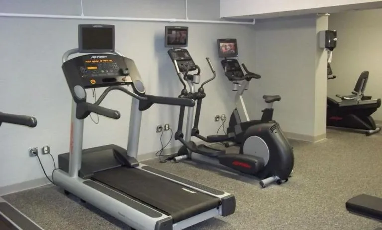 Well equipped fitness center at EnVision Hotel And Conference Center Mansfield Foxboro.
