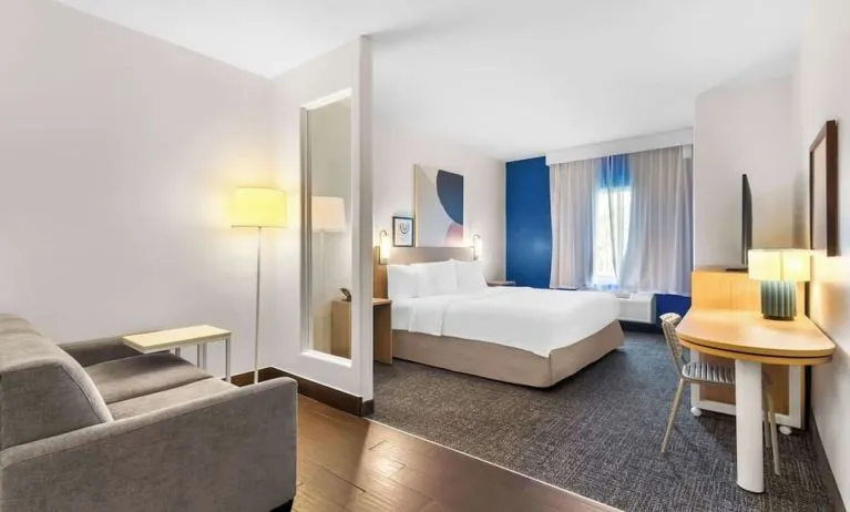 Bright and spacious day use room with lounge area at Spark By Hilton Pearland.