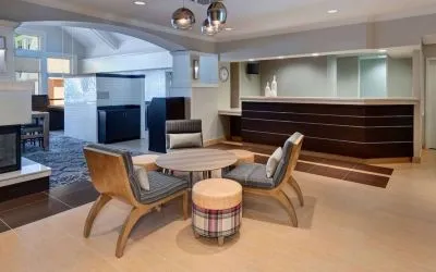 Reception and lounge area at Sonesta ES Suites Atlanta Alpharetta North Point Mall.