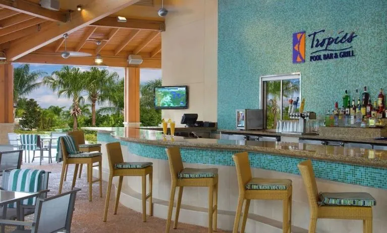 Beautiful and relaxing outdoor bar and restaurant by the pool at Hilton Orlando.