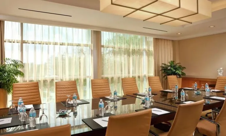Professional meeting room with natural light at Hilton Orlando.
