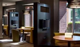 Dining area and coffee shop with comfortable seating perfect for coworking at Sonesta Select Tempe Downtown.