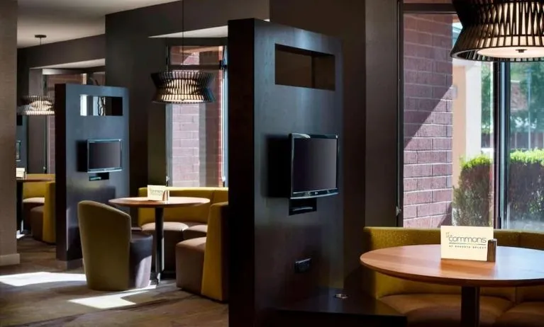 Dining area and coffee shop with comfortable seating perfect for coworking at Sonesta Select Tempe Downtown.