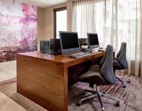 Business center with computers, printers and ergonomic chairs at Sonesta Select Raleigh Durham Airport Morrisville.
