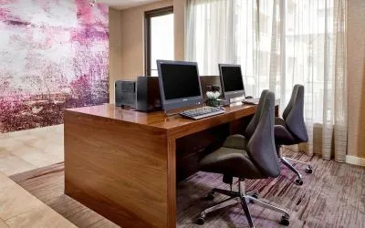 Business center with computers, printers and ergonomic chairs at Sonesta Select Raleigh Durham Airport Morrisville.