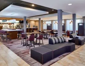 Dining area with comfortable seating perfect for coworking at Sonesta Select Raleigh Durham Airport Morrisville.
