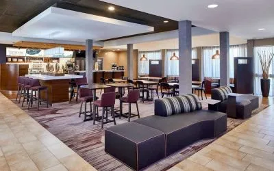 Dining area with comfortable seating perfect for coworking at Sonesta Select Raleigh Durham Airport Morrisville.