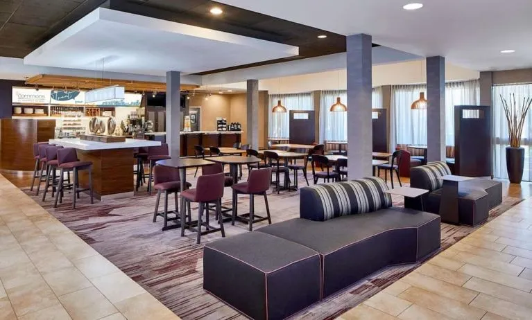 Dining area with comfortable seating perfect for coworking at Sonesta Select Raleigh Durham Airport Morrisville.