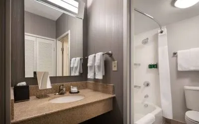 Private guest bathroom with free toiletries at Sonesta Select Phoenix Camelback.