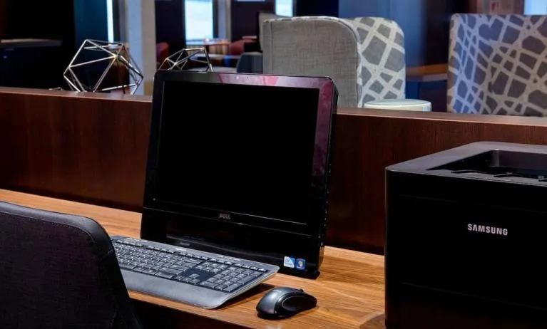 Business center with computer and printer at Sonesta Select Kansas City Airport Tiffany Springs.