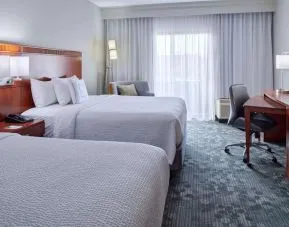 Bright and spacious day use twin room with work desk and floor to ceiling window at Sonesta Select Indianapolis Carmel.