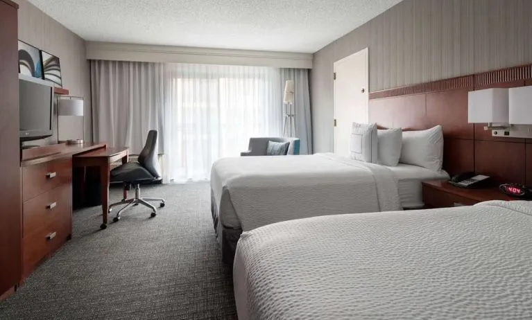 Bright and spacious day use twin room with work desk and floor to ceiling window at Sonesta Select Los Angeles LAX El Segundo.