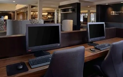 Business center with computers, printer and ergonomic chair at Sonesta Select Kansas City South Overland Park.