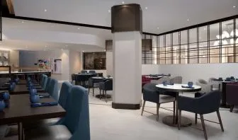 Dining area perfect for coworking at Hilton Crystal City At Washington Reagan National Airport.