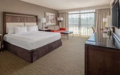 Day use room with work desk and sofa at Hilton Bellevue.