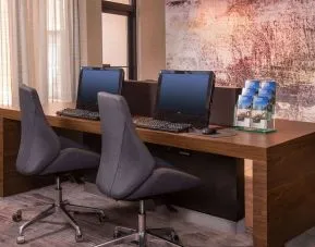 Business center with computers, printer and ergonomic chairs at Sonesta Select Columbia.