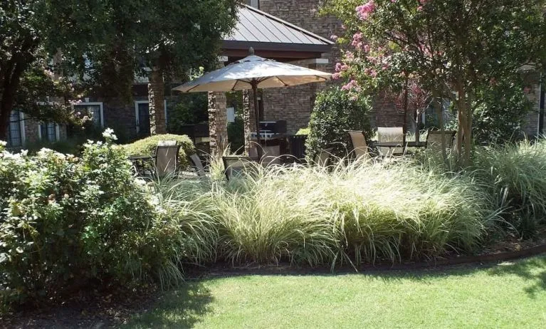 Patio with lounge seating at Sonesta ES Suites Dallas Las Colinas.