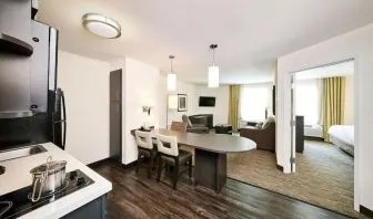 Day use suite with in-room kitchen, living area and private bathroom at Sonesta Simply Suites Plano Frisco.