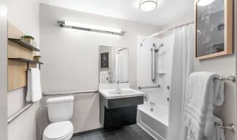Private guest bathroom at Sonesta Simply Suites Austin South.