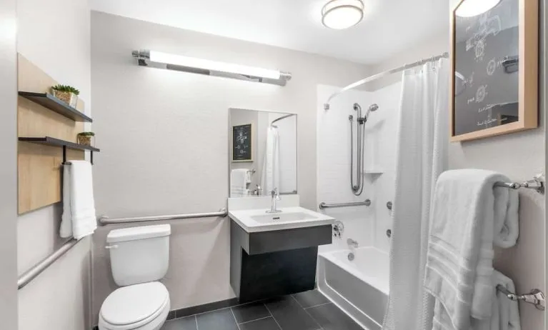 Private guest bathroom at Sonesta Simply Suites Austin South.