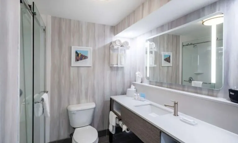 Guest bathroom with shower at Hampton Inn & Suites Amelia Island-Historic Harbor Front.