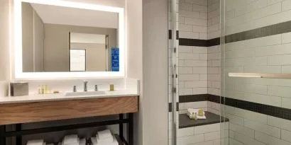 Guest bathroom with shower at DoubleTree By Hilton Canton Downtown.