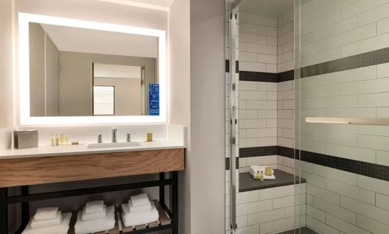 Guest bathroom with shower at DoubleTree By Hilton Canton Downtown.