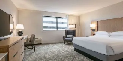 Spacious king size bed, TV and desk in a day use room at DoubleTree By Hilton Canton Downtown.