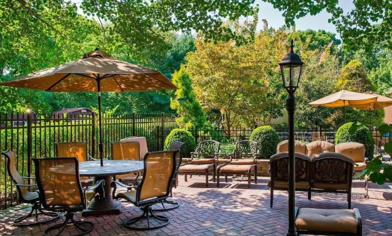 Beautiful hotel terrace with seating area at Sonesta Select Tinton Falls Eatontown.