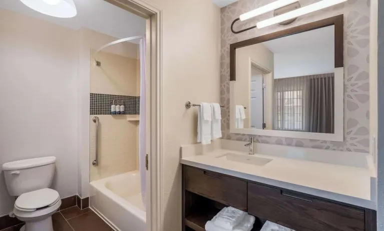 Private guest bathroom with combined shower and tub at Sonesta ES Suites Austin The Domain Area.