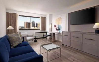 Room workspace with living area at Sonesta White Plains Downtown.
