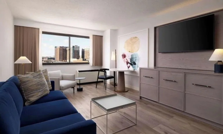 Room workspace with living area at Sonesta White Plains Downtown.