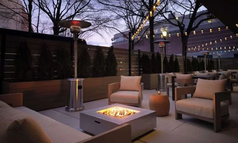 Patio with lounge seating and fire pit at Sonesta White Plains Downtown.