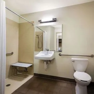 Accessible private guest bathroom with shower at Sonesta Simply Suites St Louis Earth City.