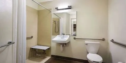 Accessible private guest bathroom with shower at Sonesta Simply Suites St Louis Earth City.